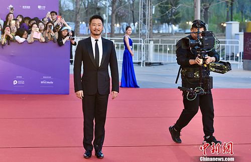 吳京亮相北京電影節(jié)。<a target=&apos;_blank&apos;  data-cke-saved-href=&apos;http://www.chinanews.com/&apos; href=&apos;http://www.chinanews.com/&apos; ><p  align=